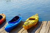 Picture of three kayaks on dock on a sunny day
