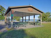 Pavilion E on a sunny day with Cayuga Lake in the background
