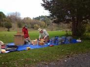 Volunteers preparing birdhouses