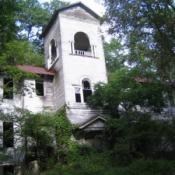Ludlowville Union School, white, green leafy trees surrounding it